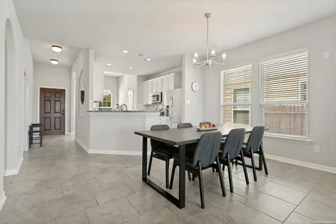 a view of a dining room with furniture and window