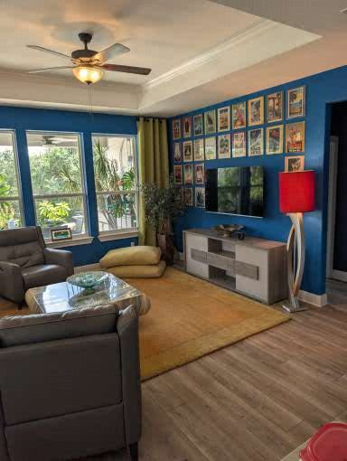 336 Kitty Hawk Road Georgetown, TX 78633 - Photo 6 of 40 Gleaming wood-look floors complement the tray ceiling design in this welcoming living space.