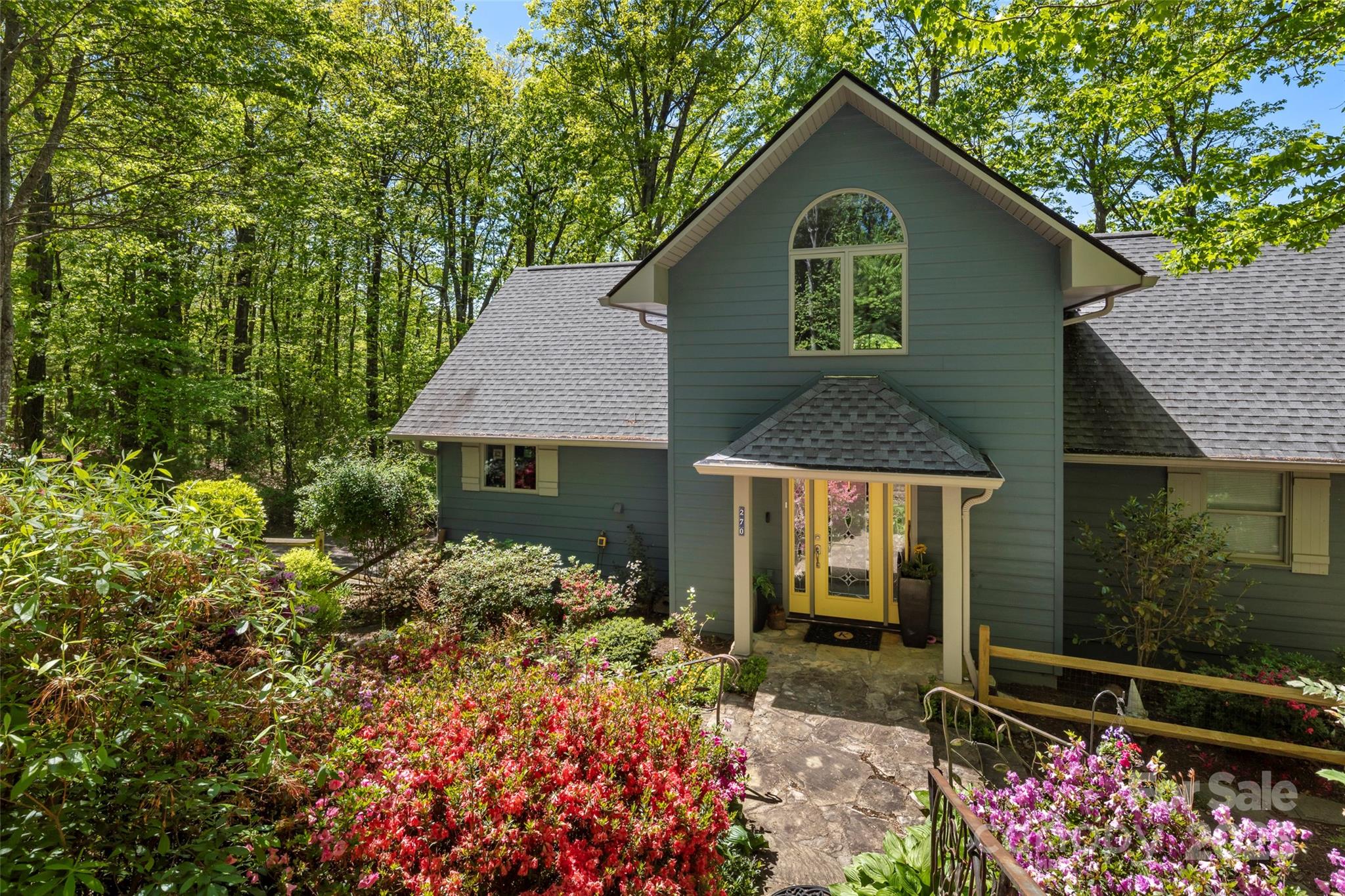 270 Ridge Drive Saluda, NC 28773 - Photo 11 of 32 a front view of a house with a yard