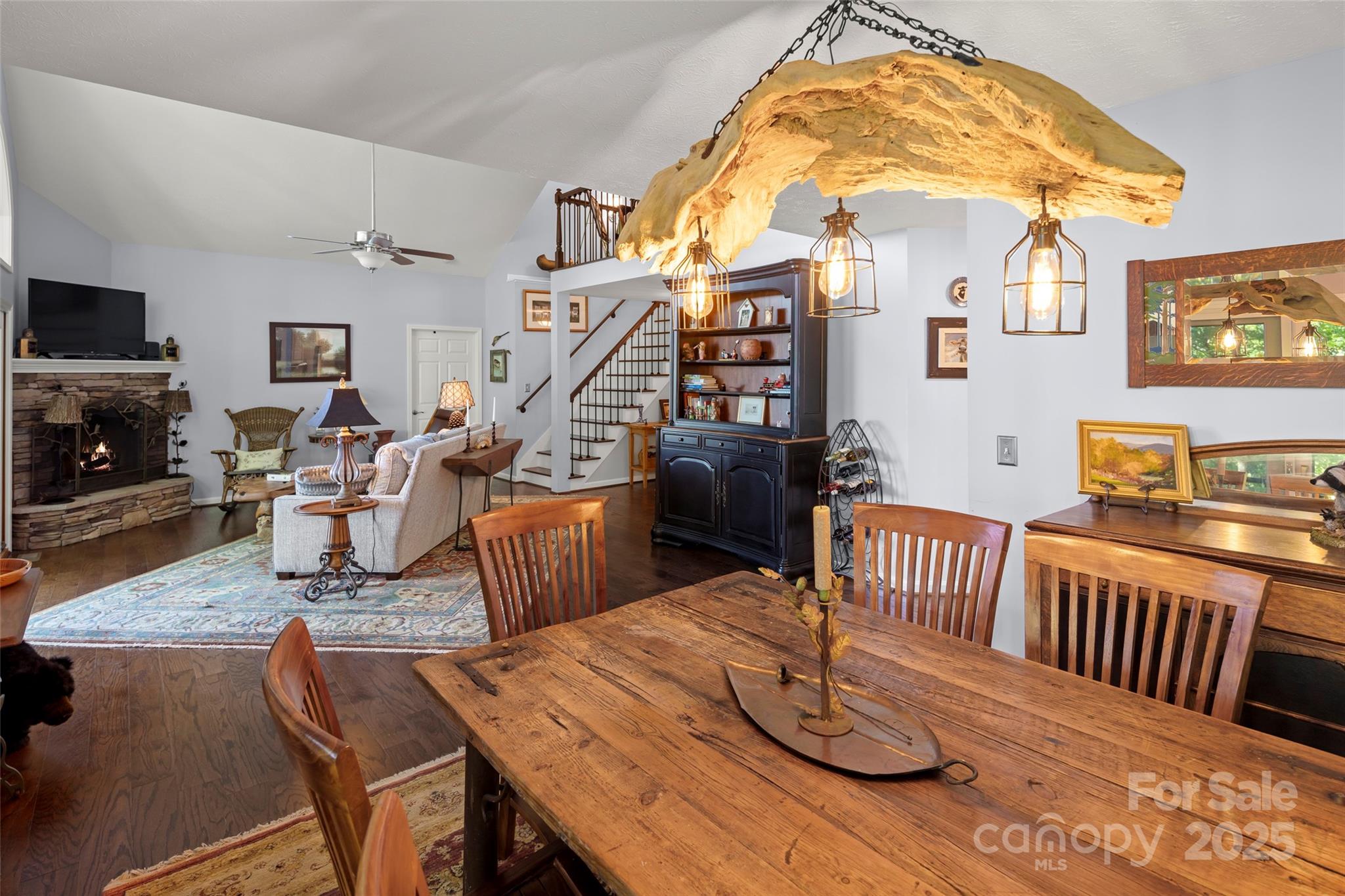 270 Ridge Drive Saluda, NC 28773 - Photo 18 of 32 a dining room with wooden floor furniture and a chandelier