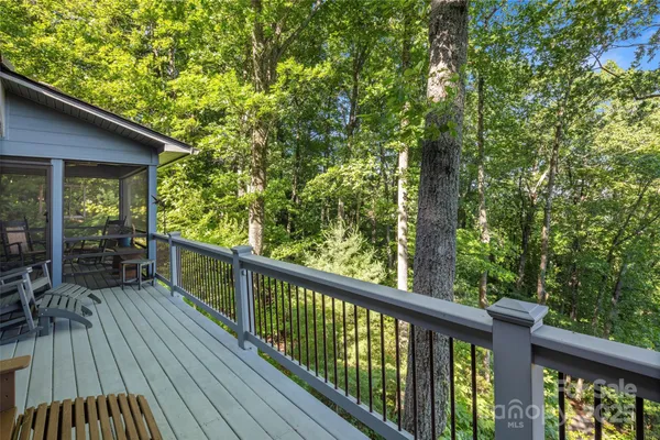 a view of balcony with deck and outdoor seating