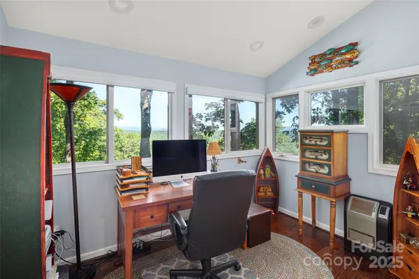 a bathroom with a granite countertop sink a mirror and a shower