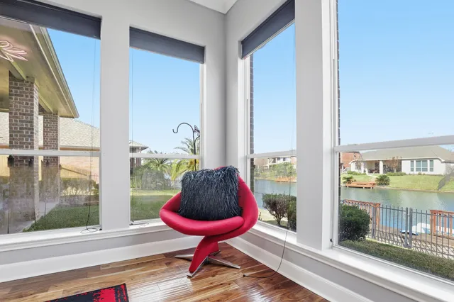 a bathroom with a tub a sink and mirror