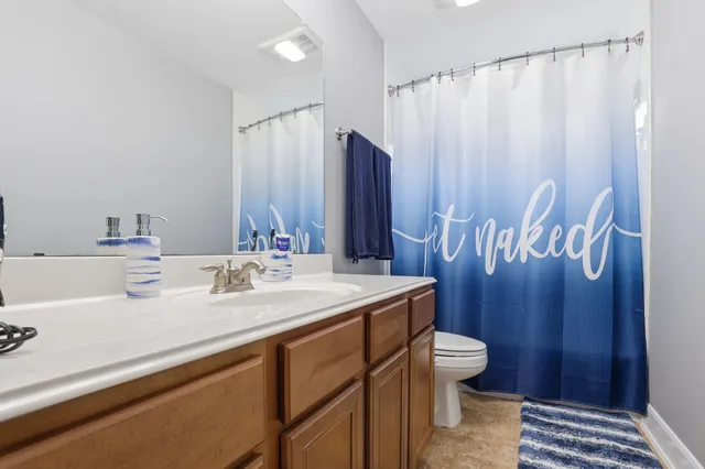 a bedroom with bed and balcony