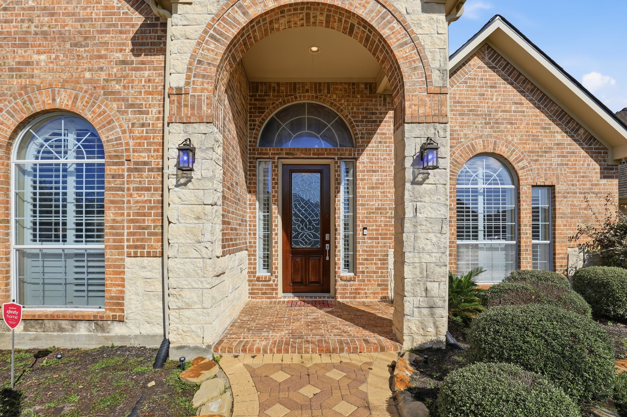 18014 Grotto Point Drive Cypress, TX 77429 - Photo 2 of 25 a front view of a house with garden