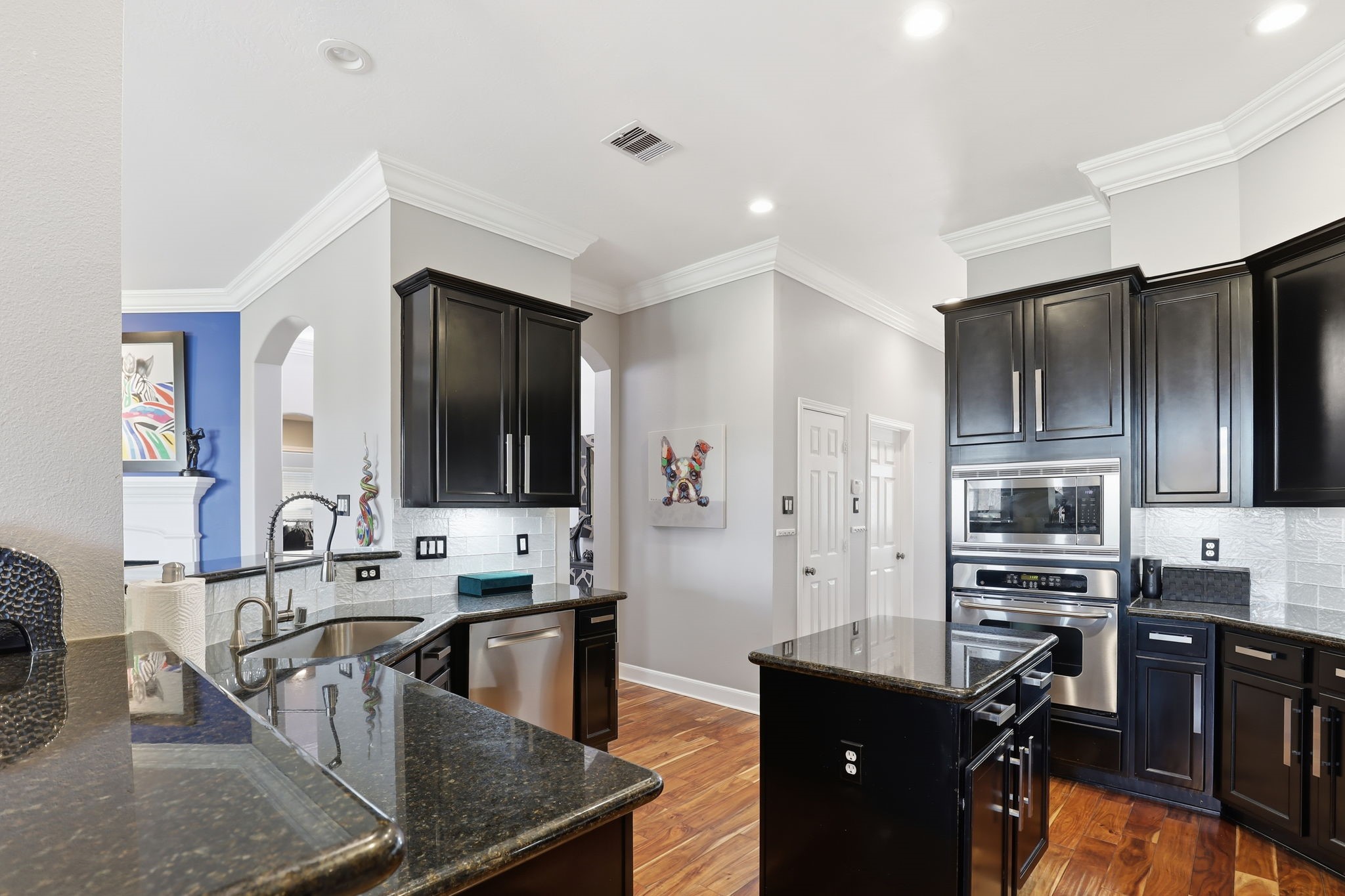 18014 Grotto Point Drive Cypress, TX 77429 - Photo 10 of 25 a kitchen with stainless steel appliances granite countertop a sink stove and refrigerator