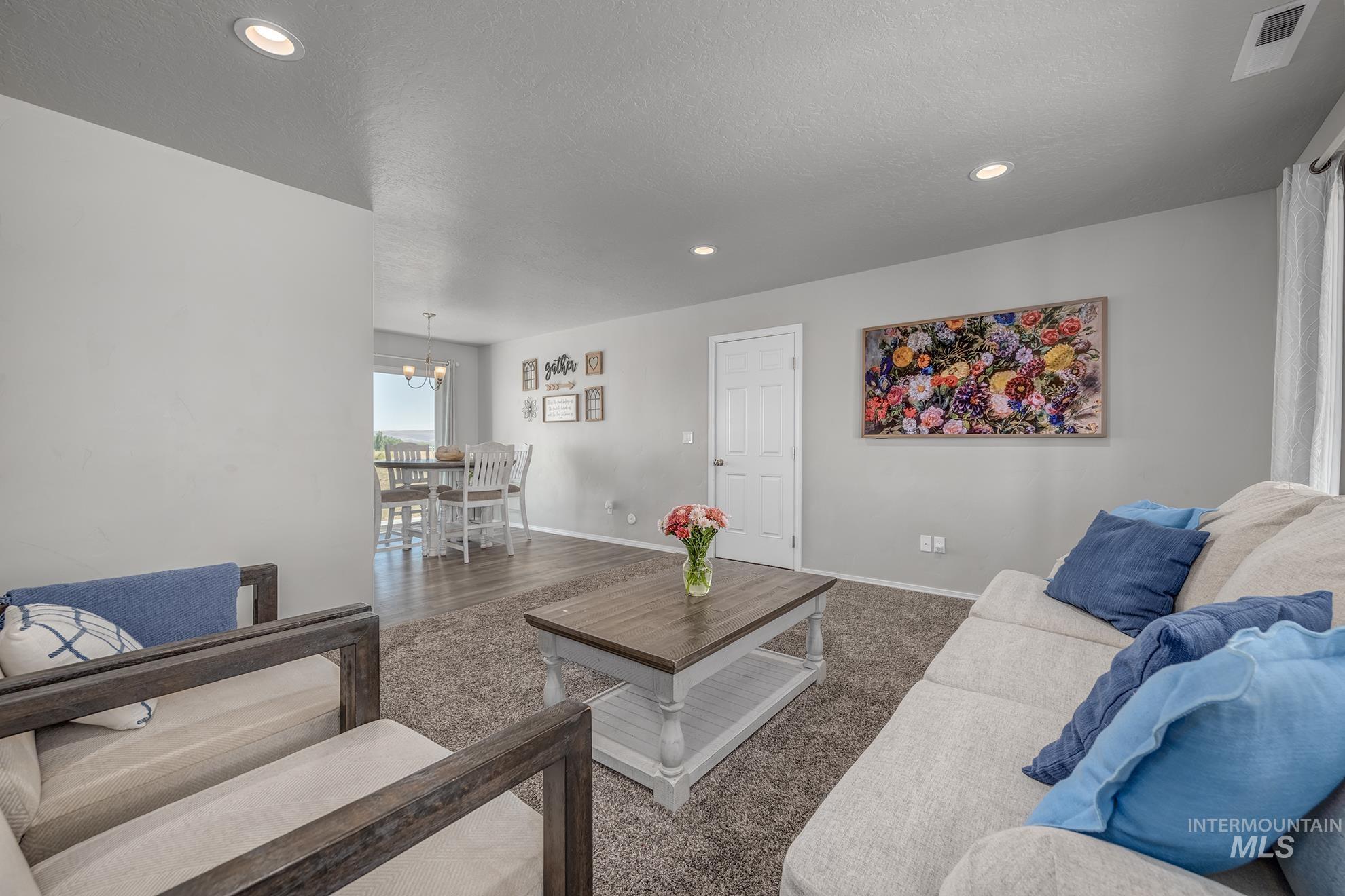 1049 Price Road Weiser, ID 83672 - Photo 5 of 47 Living area with neutral wall tones and recessed lighting
