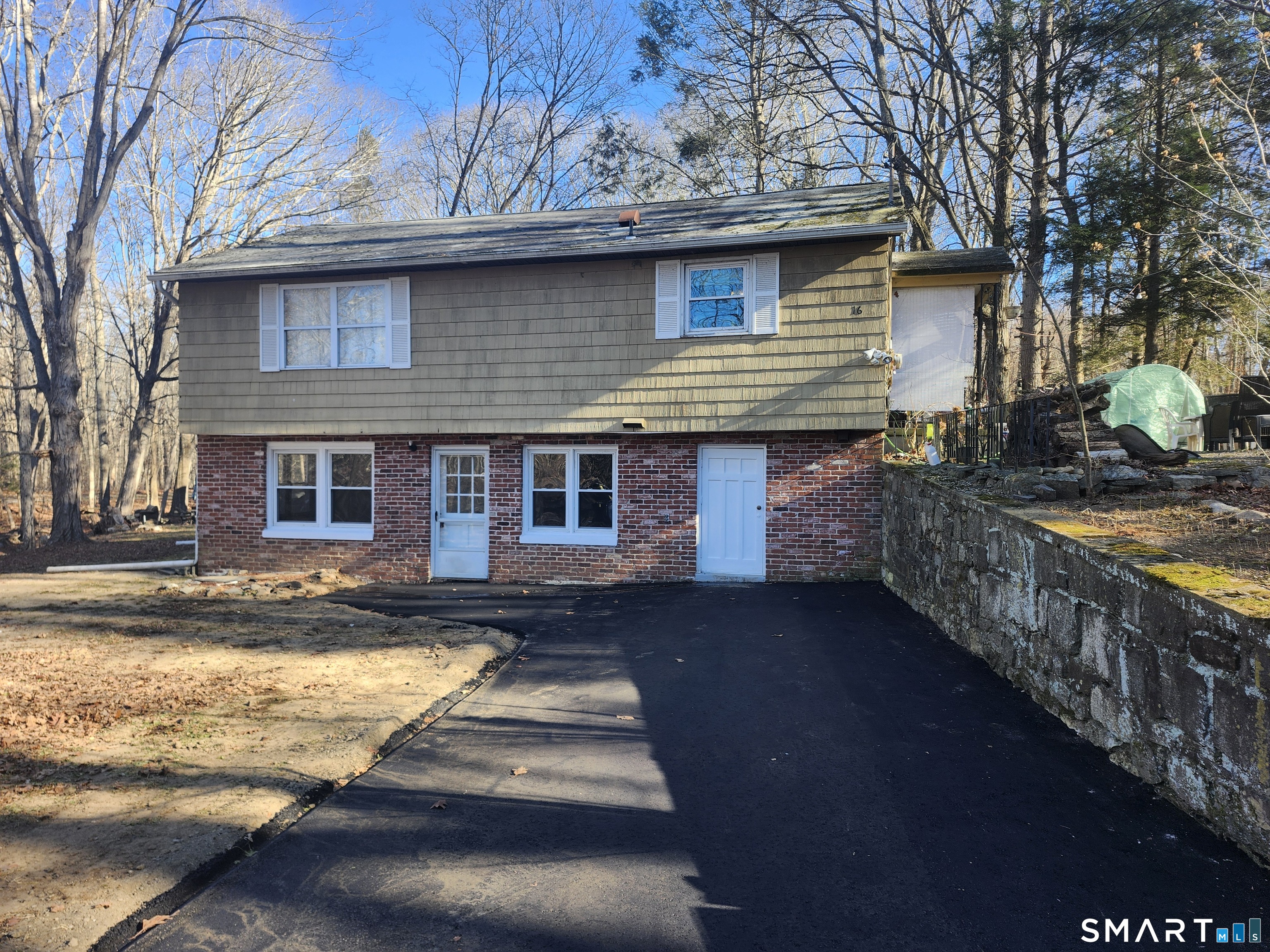 16 Polly Road, Unit A Lebanon, CT 06249 - Photo 1 of 9 a front view of a house with a yard