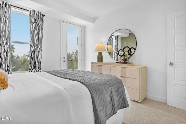 a bedroom with a bed and a mirror