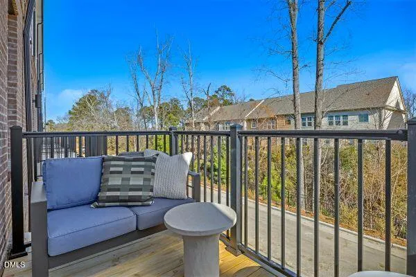 a view of a balcony with furniture