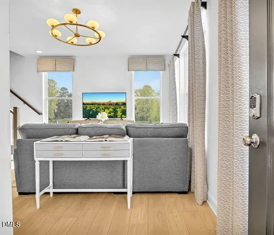 a living room with a couch and a large window