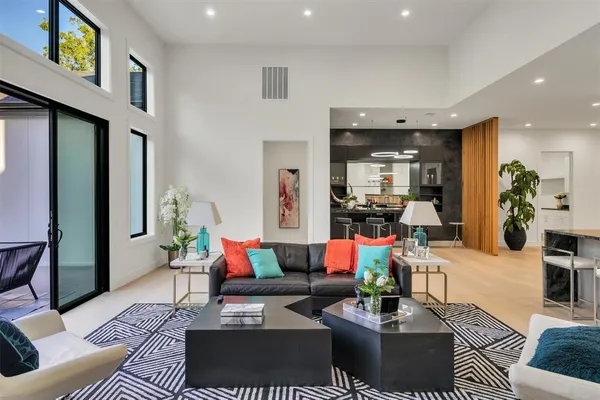 a living room with furniture fireplace and window