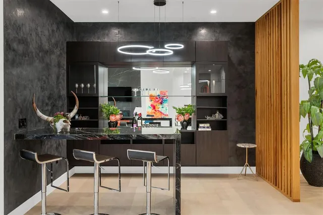 a kitchen with stainless steel appliances kitchen island granite countertop a sink and cabinets