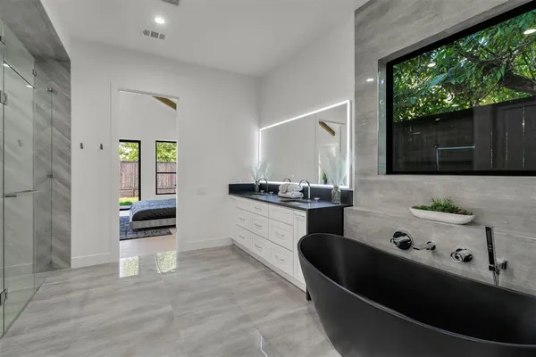 a kitchen with stainless steel appliances kitchen island sink stove and cabinets