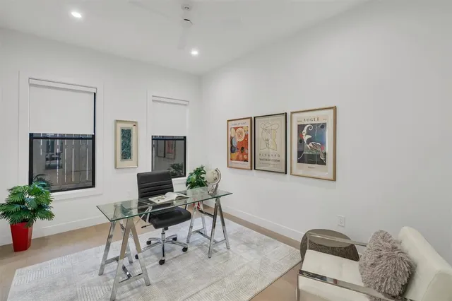 a work room with furniture and flowers