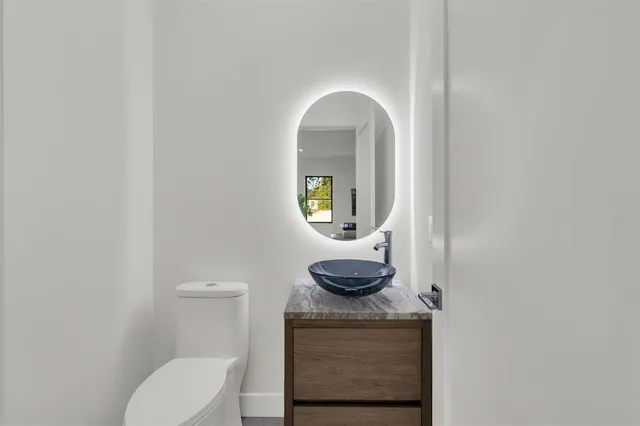 a bathroom with a toilet and a sink