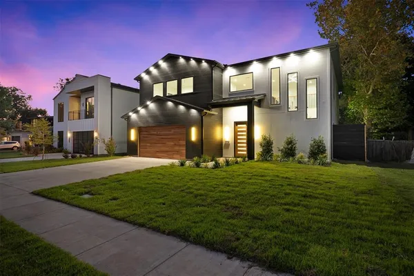 a front view of a house with swimming pool and furniture