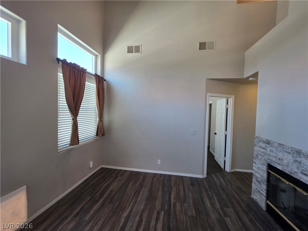 2275 Ramsgate Drive Henderson, NV 89074 - Photo 22 of 84 Sun-filled interiors complement a modern fireplace and durable plank flooring.