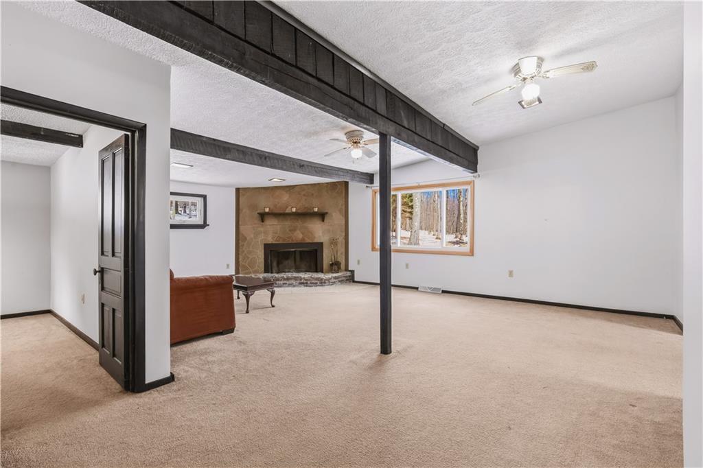 255 Evergreen Lane Acme, PA 15610 - Photo 13 of 27 a view of an empty room with chandelier fan and windows