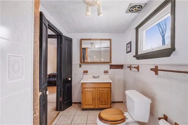 a view of street with large trees