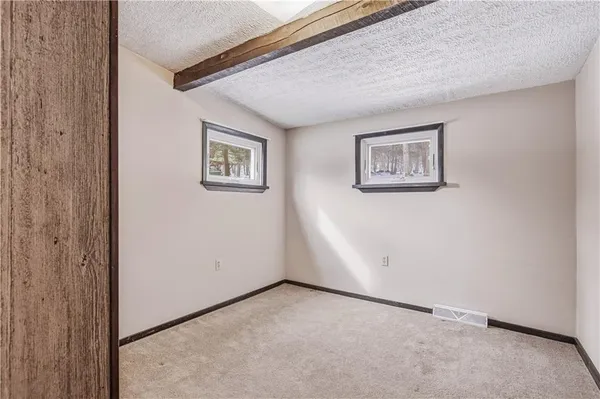 a backyard of a house with barbeque oven