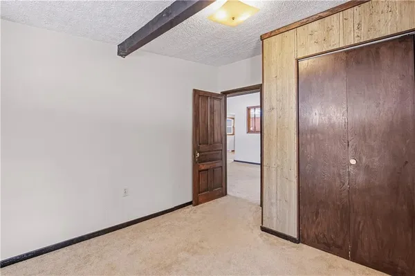 a view of a yard with snow on the road