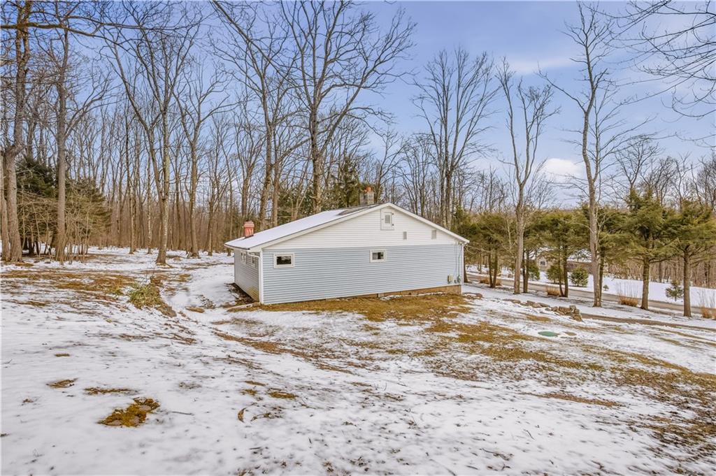 255 Evergreen Lane Acme, PA 15610 - Photo 23 of 27 a view of yard with a house in the background