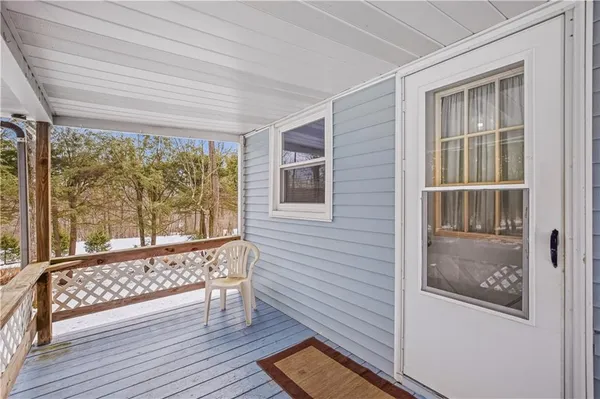 a view of wooden floor and a window