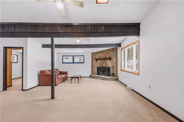 a view of livingroom with furniture and a fireplace