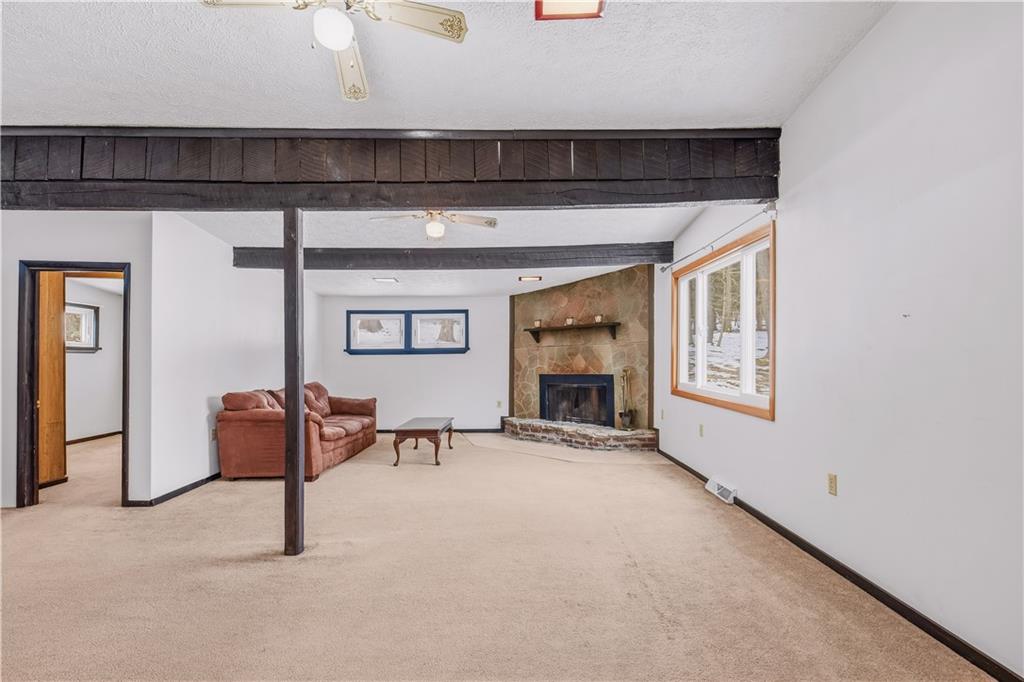 255 Evergreen Lane Acme, PA 15610 - Photo 9 of 27 a view of livingroom with furniture and a fireplace