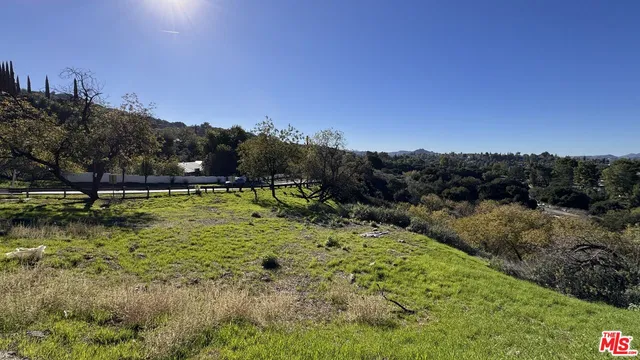 a view of swimming pool with a yard