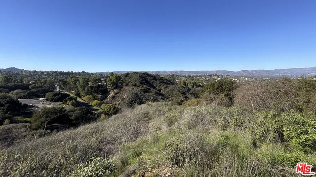 a view of a road with a yard