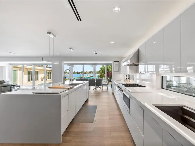 a large kitchen with stainless steel appliances lots of counter top space