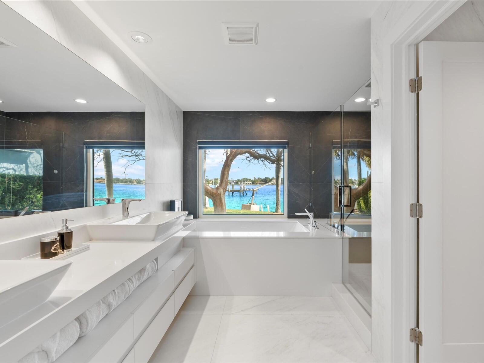 714 South Lake Drive Lantana, FL 33462 - Photo 19 of 41 a large white kitchen with a large window