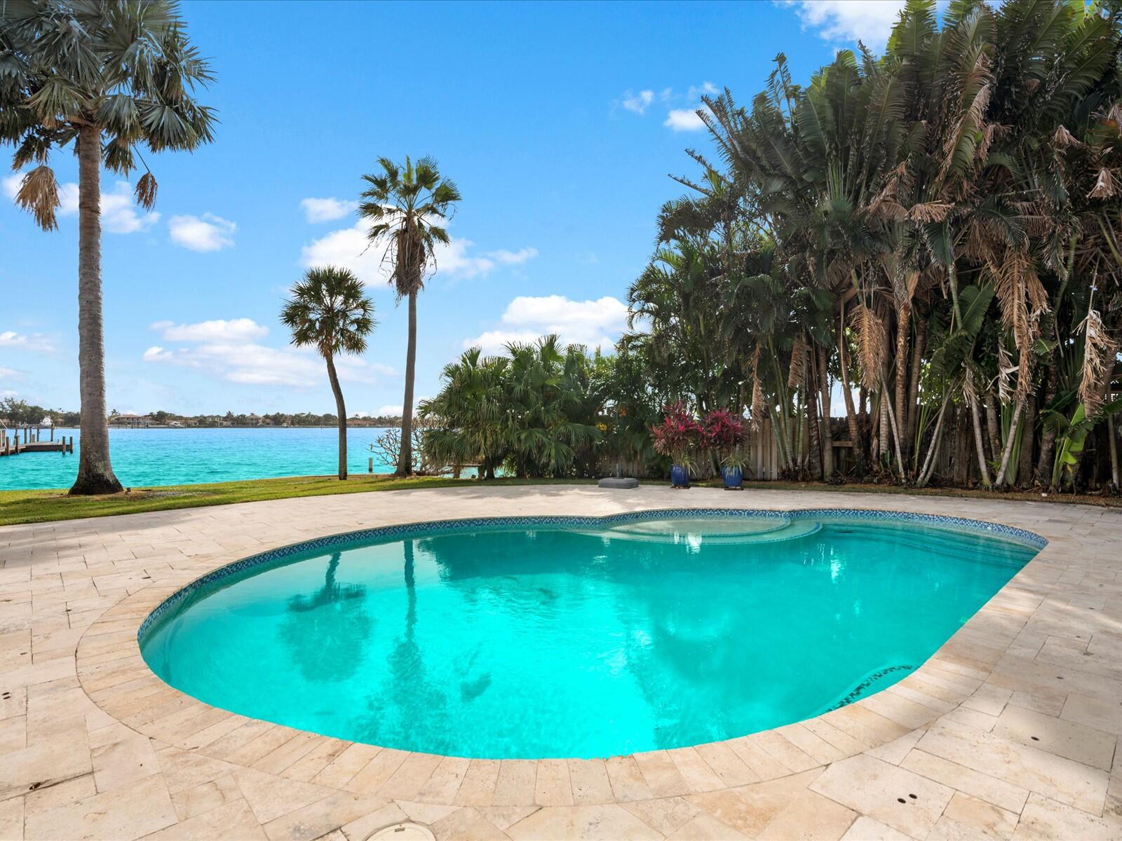 714 South Lake Drive Lantana, FL 33462 - Photo 30 of 41 a view of a swimming pool with an outdoor space and seating area
