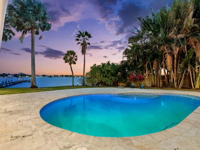 a view of a swimming pool with an outdoor space and seating area