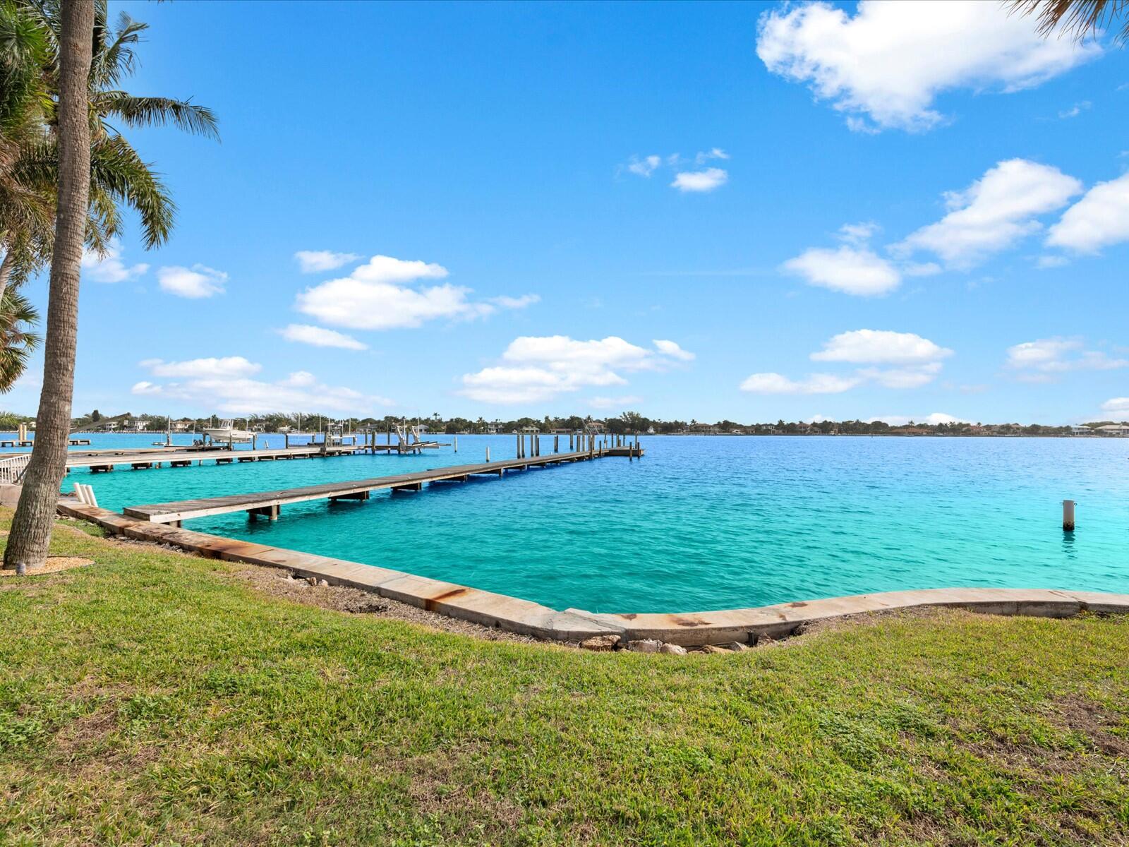 714 South Lake Drive Lantana, FL 33462 - Photo 35 of 41 a view of a lake and a yard