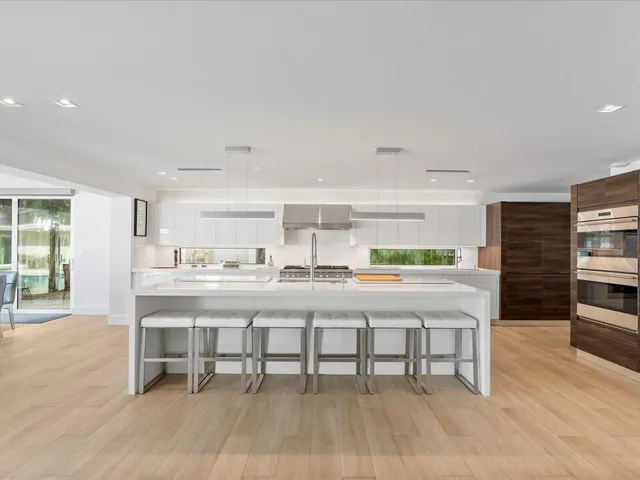 a kitchen with a table and chairs in it