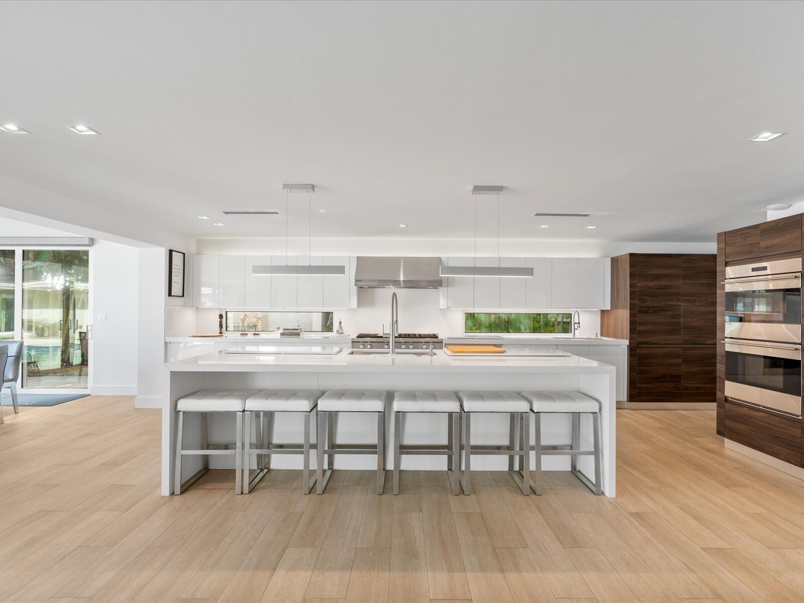 714 South Lake Drive Lantana, FL 33462 - Photo 7 of 41 a kitchen with a table and chairs in it