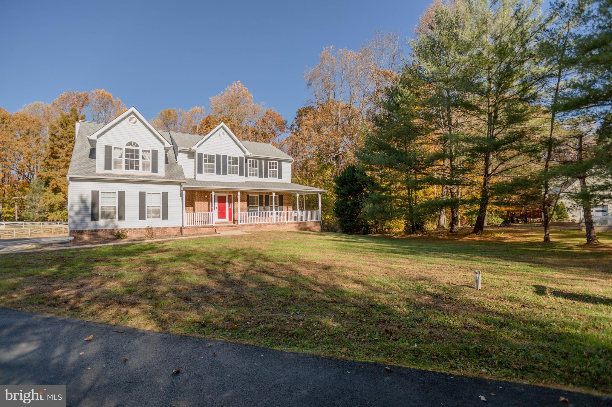 620 Small Reward Road Huntingtown, MD 20639 - Photo 31 of 33 a front view of a house with a garden