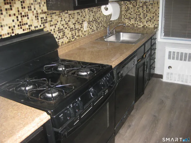 a kitchen with a stove and a sink