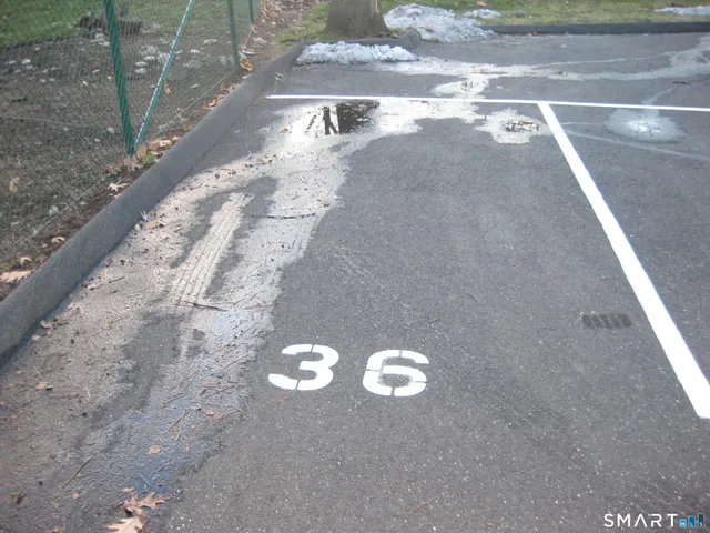 a view of street with parked cars