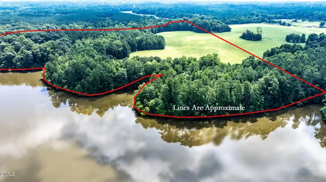 a view of a swimming pool with a yard and outdoor seating