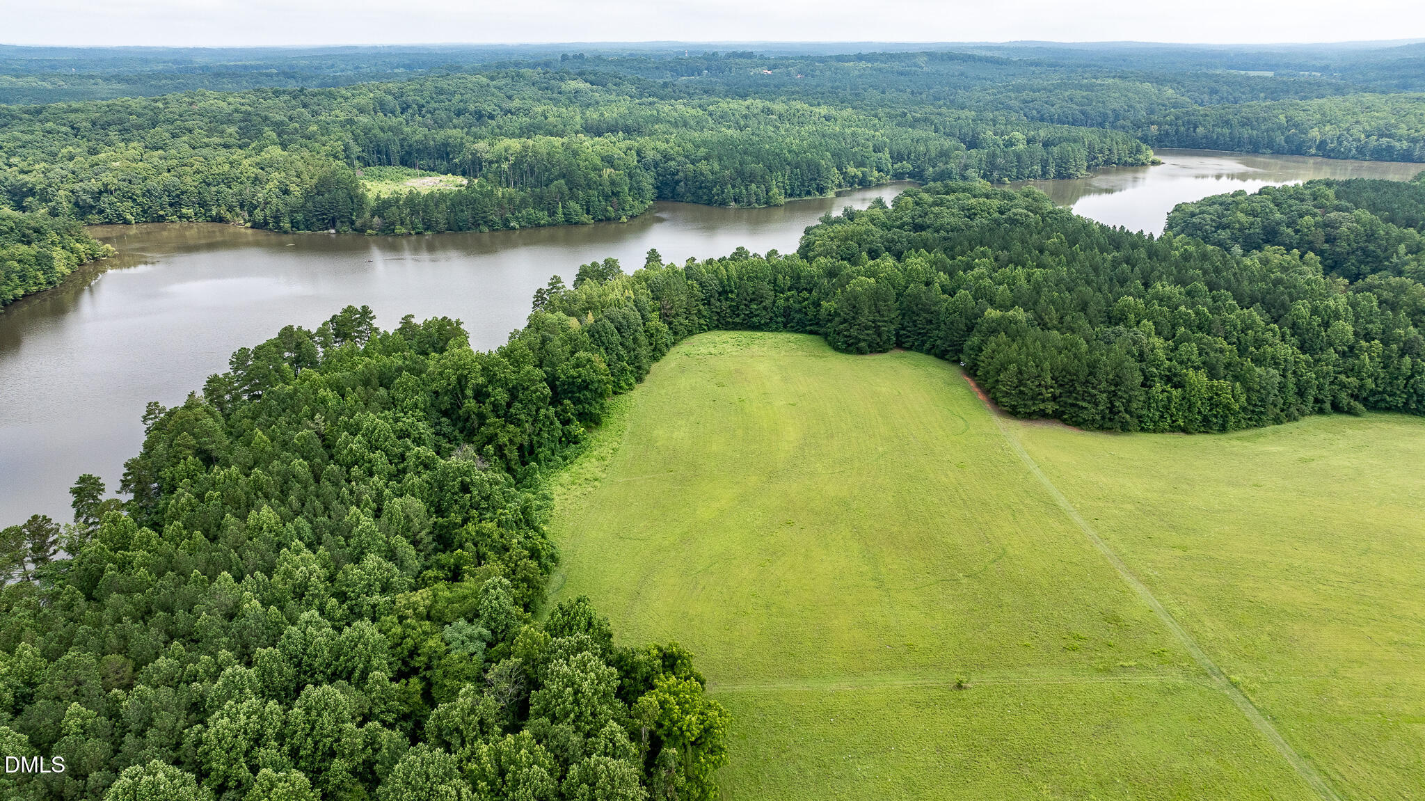 0 Teer Road Chapel Hill, NC 27516 - Photo 29 of 40 a view of a lake with a yard