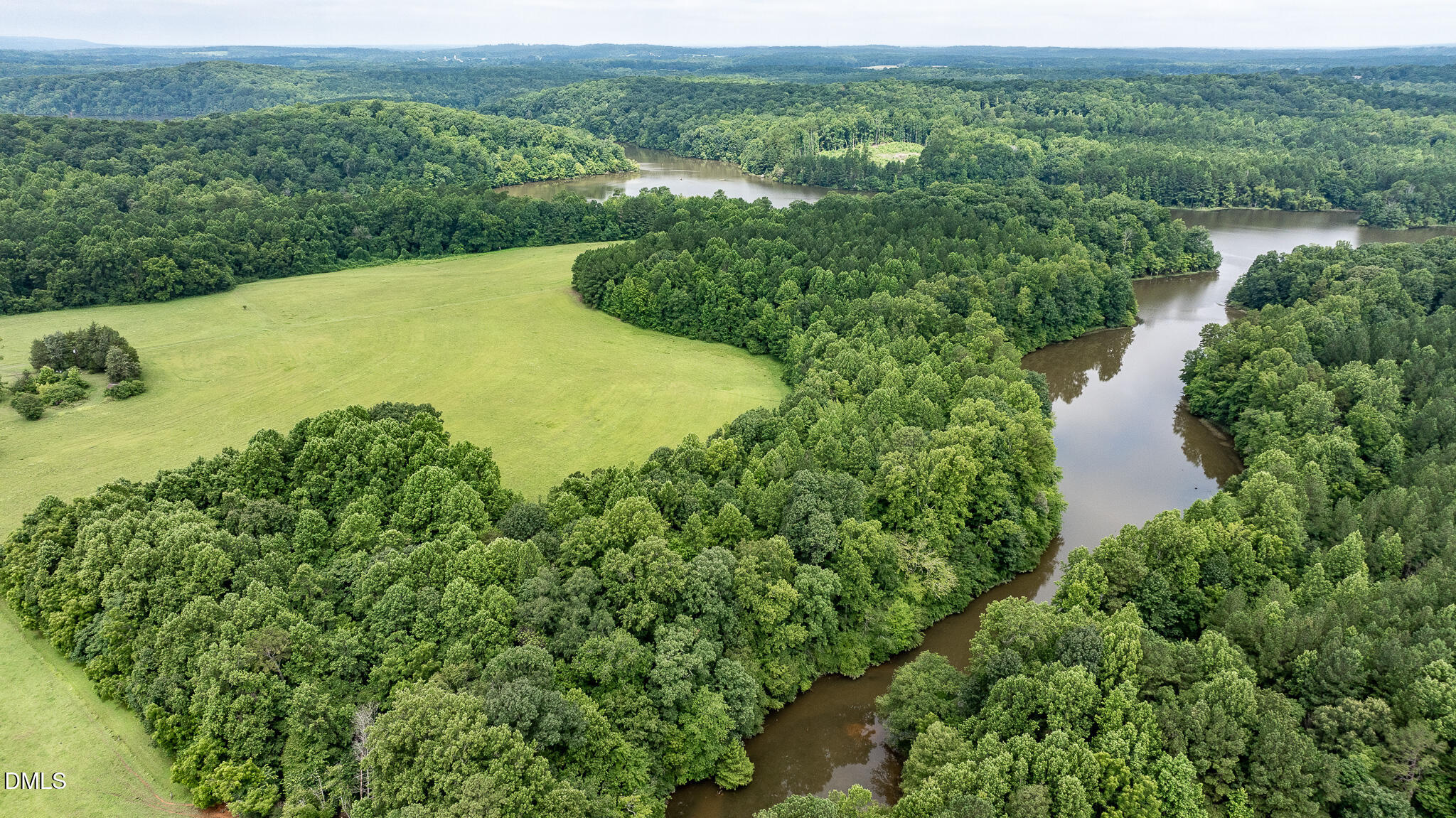 0 Teer Road Chapel Hill, NC 27516 - Photo 31 of 40 a view of a lake with a city