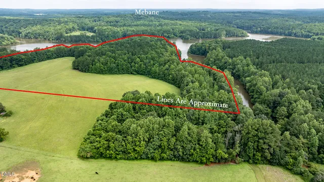 a view of a garden with a building in the background