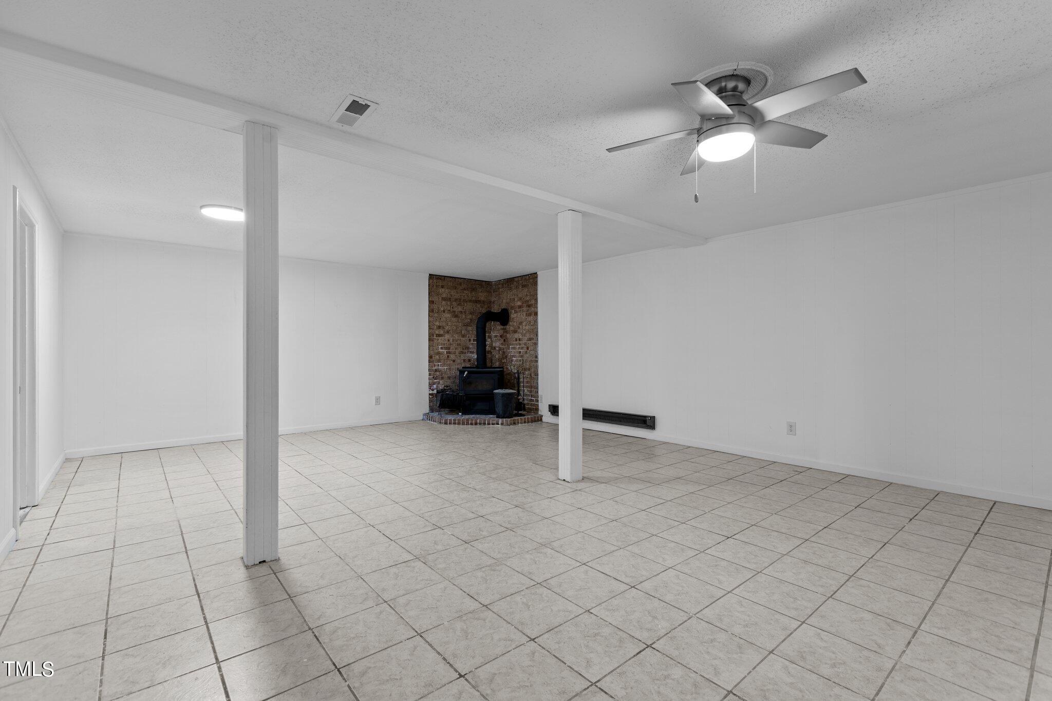 6415 Whitt Road Durham, NC 27712 - Photo 26 of 37 an empty room with fan