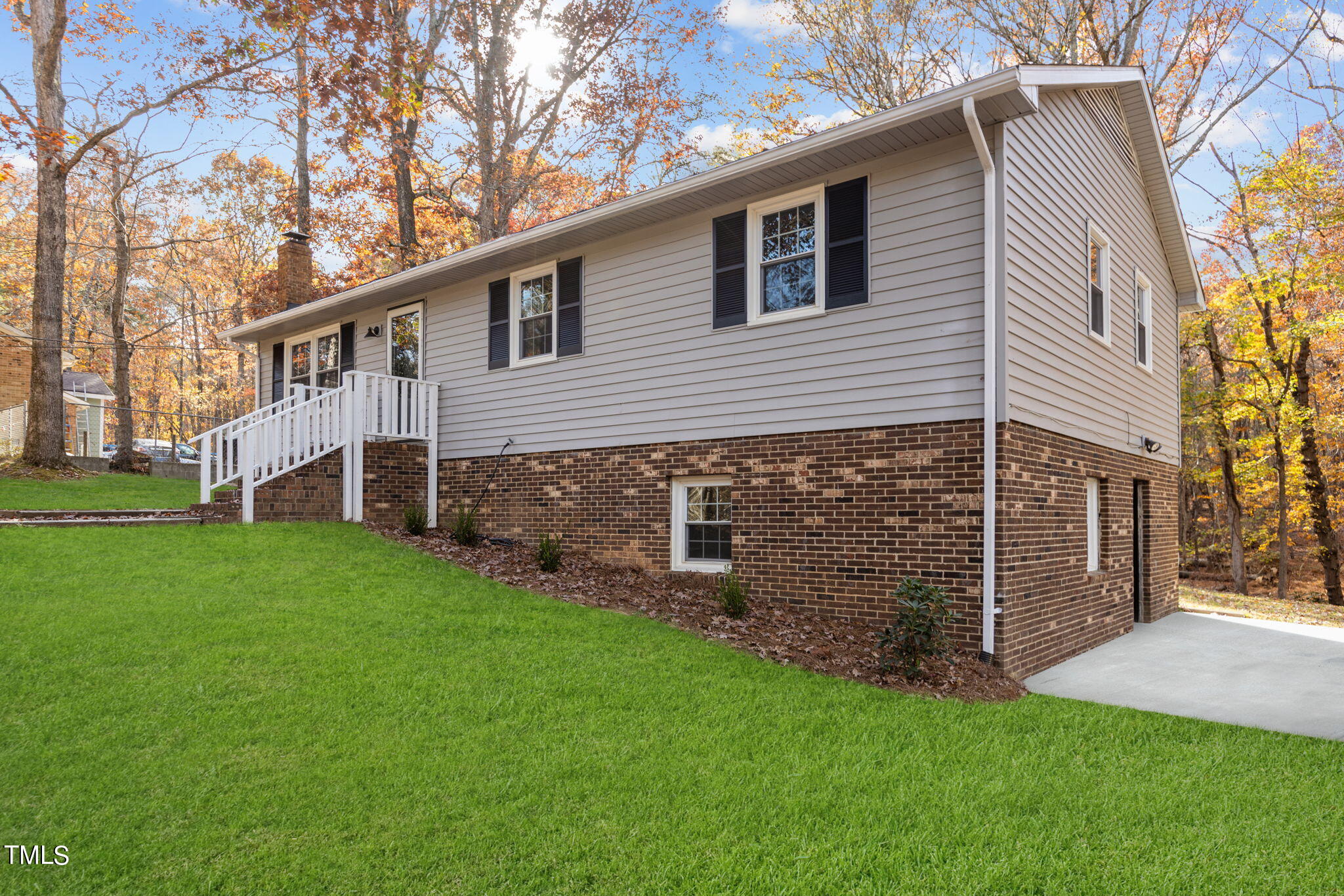 6415 Whitt Road Durham, NC 27712 - Photo 34 of 37 a view of a house with a yard