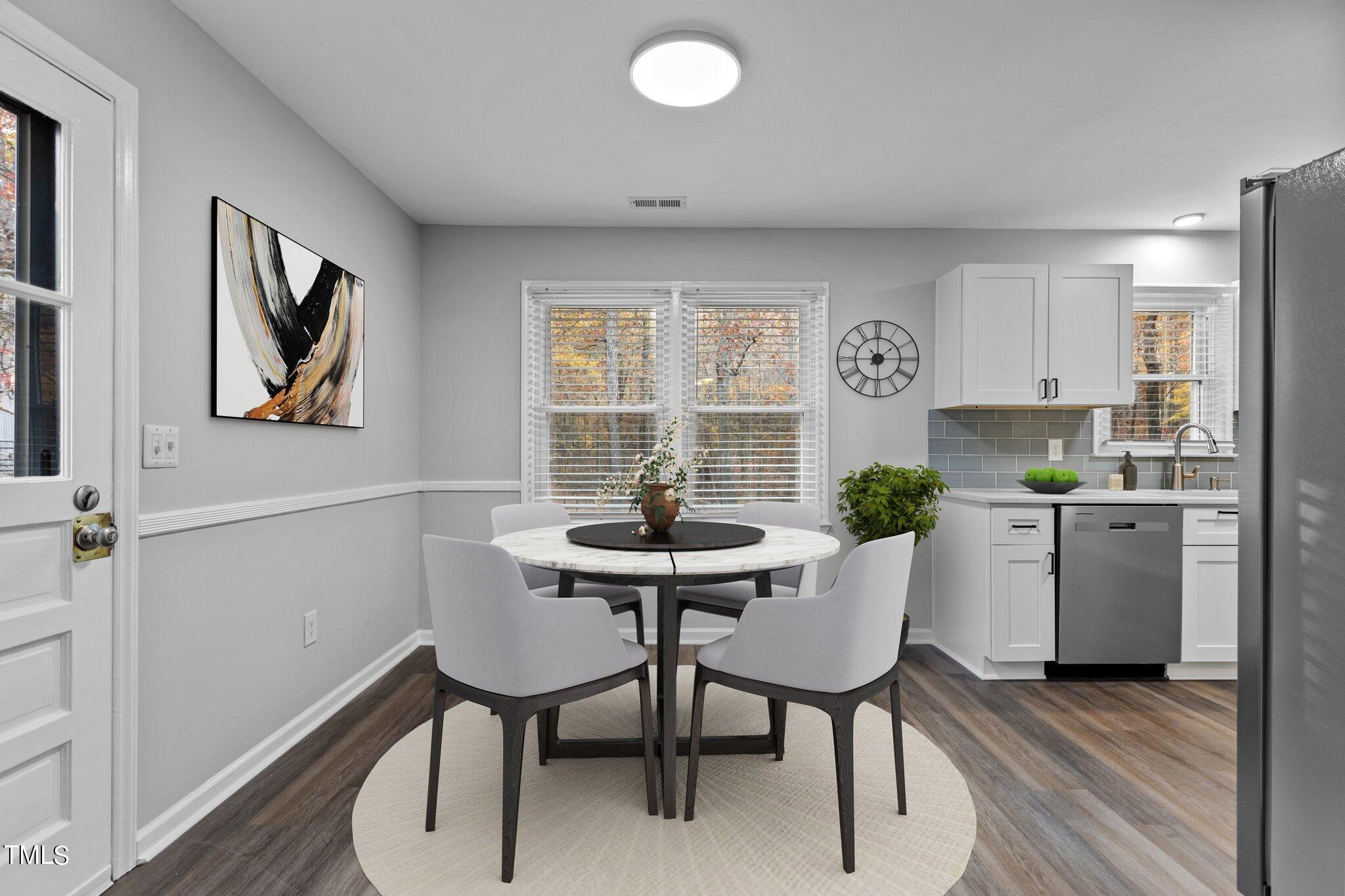 6415 Whitt Road Durham, NC 27712 - Photo 4 of 37 a view of a dining room with furniture and window