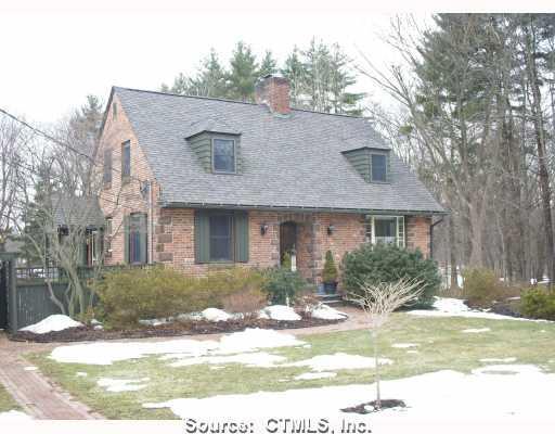 Exterior Front. Charming brick and stone Cape w/beautiful landscaping